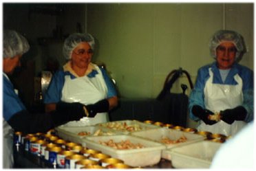 putting the meat in cans Lismore fish plant