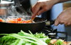 Cooking in a frying pan.
